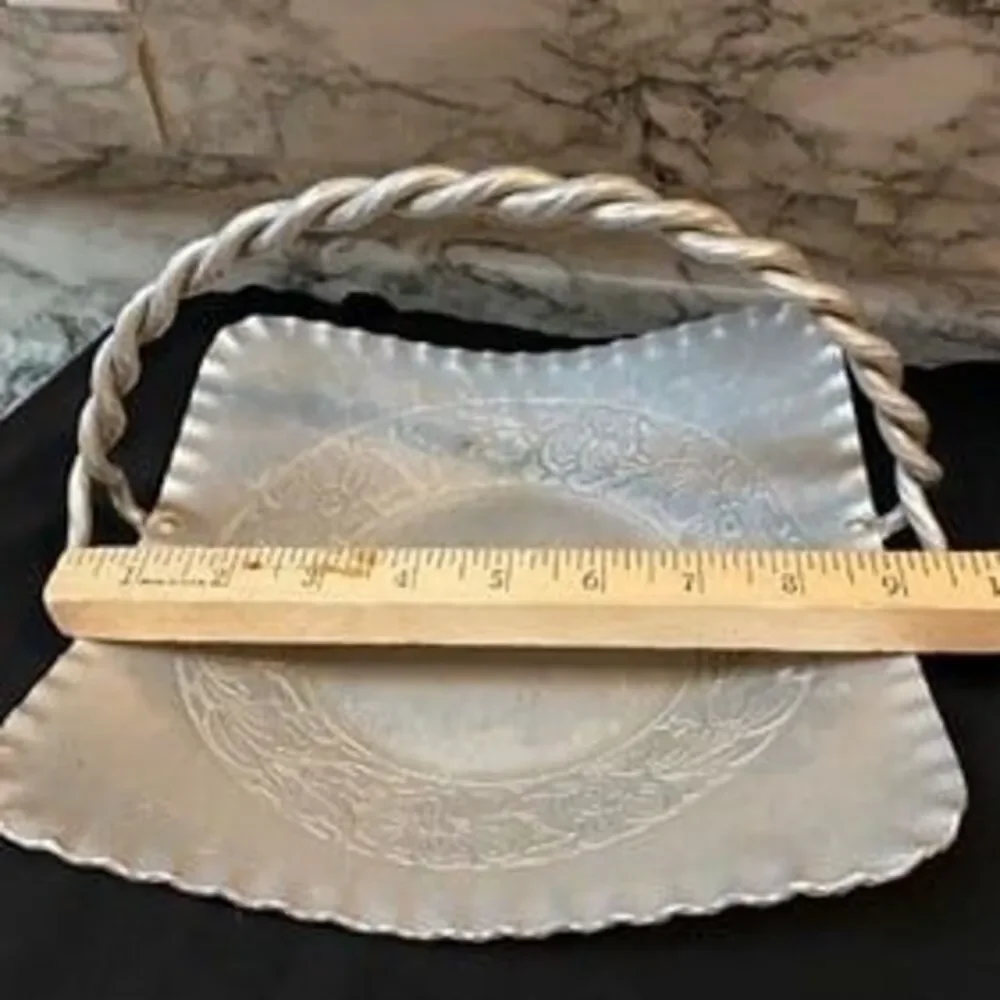 * hand-forged hammered aluminum basket engraved floral bouquet twisted handle